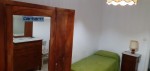 Annuncio affitto Viterbo stanza arredata con mobili in legno